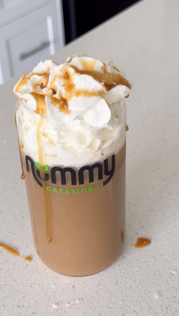 Salted Caramel Iced Caffeine-free coffee topped with whipped cream and caramel sauce, made with Nummy Creations Herbal Coffee alternative in Caramel flavour